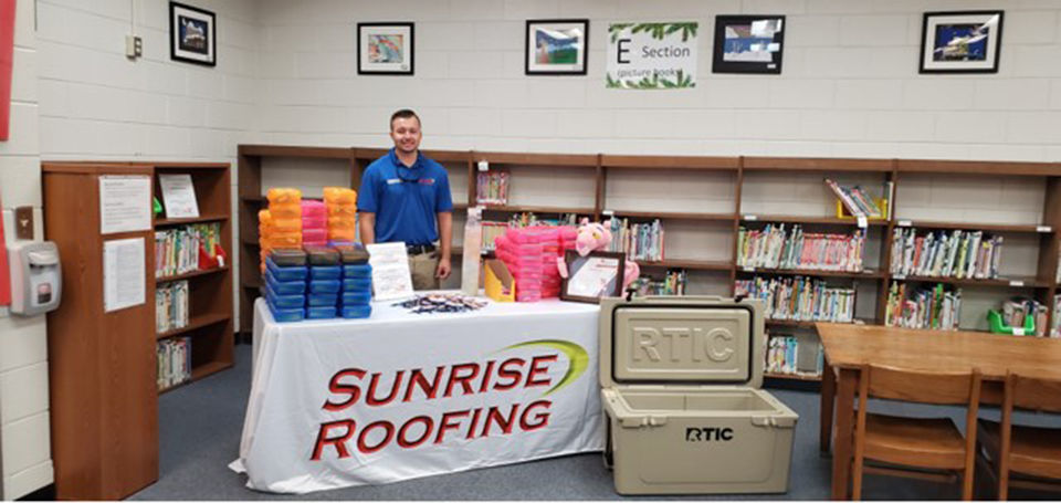 Sunrise Roofing donates supplies to Auburn Elementary